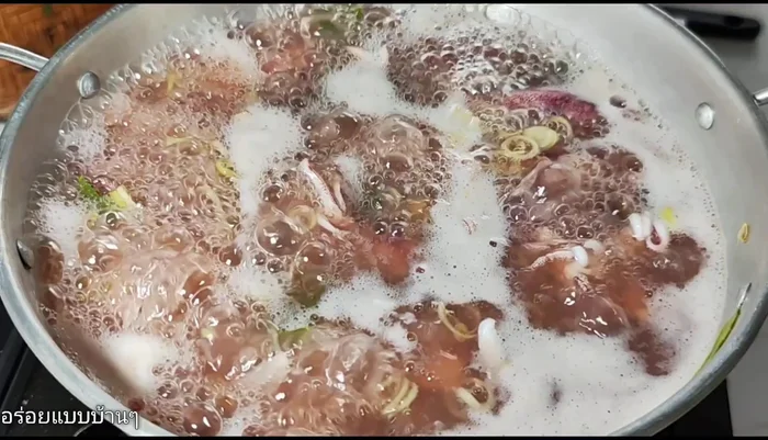 Once the squid is cooked (water boils), turn off the heat. Add chili and cook with the lid closed.