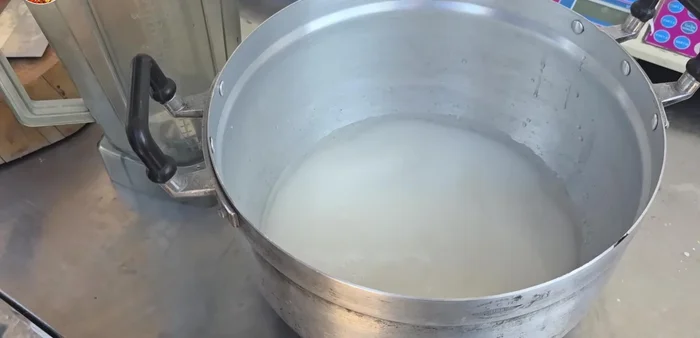 Prepare the dipping sauce: Combine sugar, vinegar, salt, chili, garlic, pickled garlic, and water. Simmer until thickened.