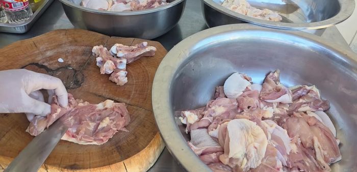 Prepare the chicken marinade. Slice the chicken thinly.