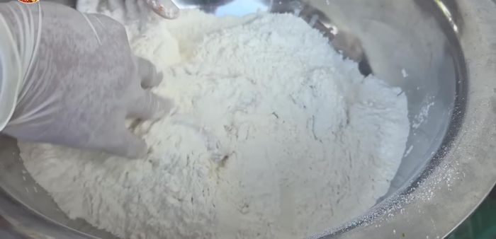 Coat the marinated chicken in dry flour, then wet flour, then dry flour again.