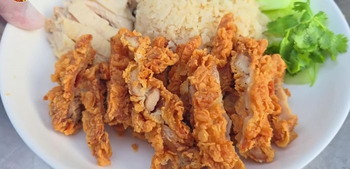 Serve the crispy fried chicken with chicken rice and dipping sauce.