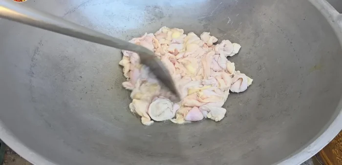 Fry chicken skin to extract oil for the rice.