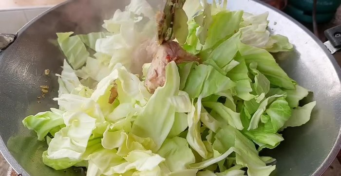 Add cabbage and stir-fry until wilted.
