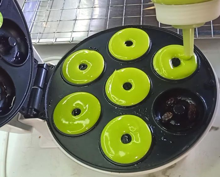 Prepare the mixture: Mix flour and divide ingredients into 3 parts. Part 1: Combine eggs, salt, and milk. Add condensed milk and sugar, then beat with a hand whisk until sugar dissolves.