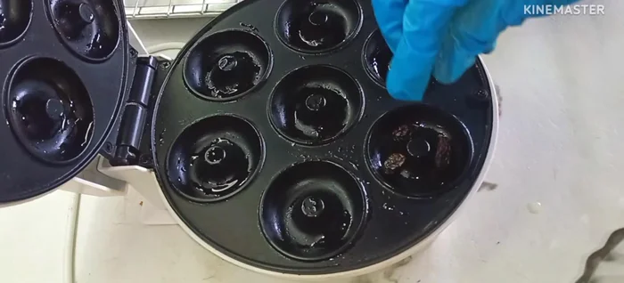 Pipe the batter into the donut molds, filling them almost to the brim. Add desired toppings (dried raisins, etc.).