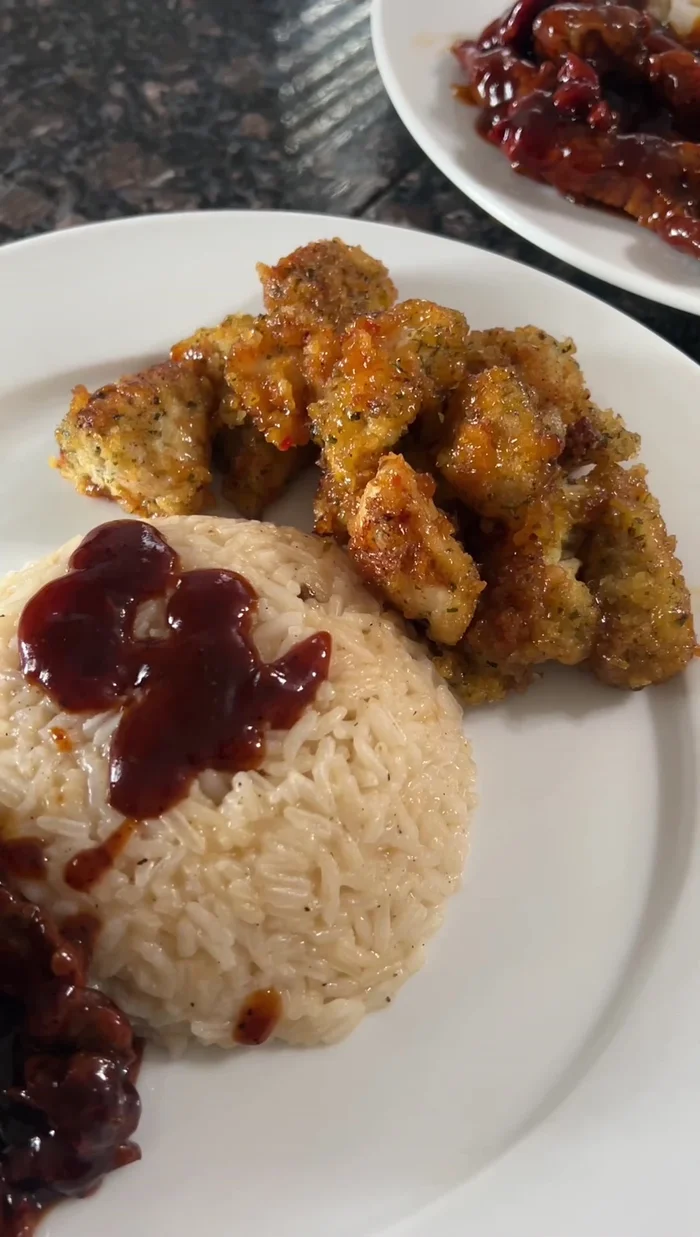 Combine the cooked chicken with sweet Thai chili sauce. (Specific method not detailed in transcript)