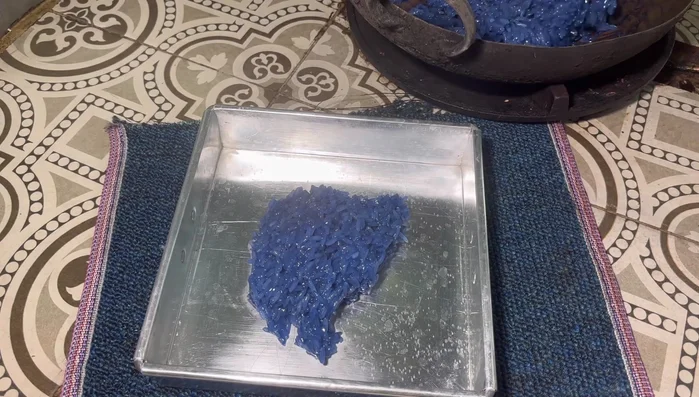 Transfer the sticky rice mixture to an 8x8 inch tray and spread it evenly.