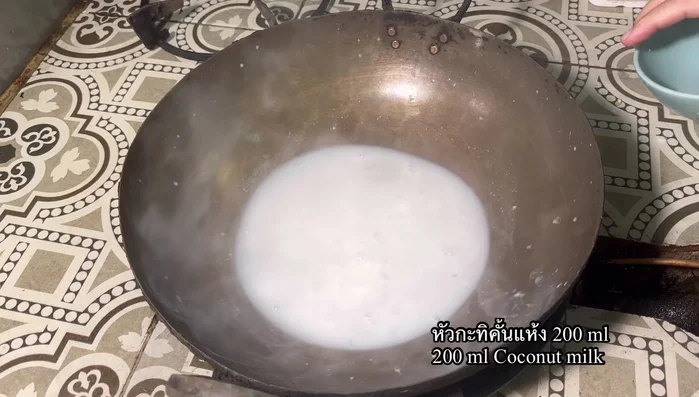 Heat a brass pan over medium heat. Add coconut cream, pink salt, and sugar. Stir gently until sugar dissolves.