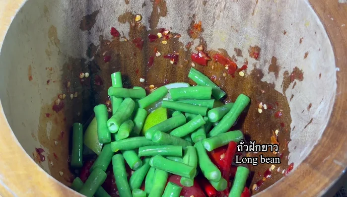 Add blanched long beans.
