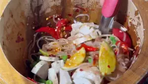 Spicy Papaya Salad (Som Tum) with Thin Noodles: A Simple Lao Recipe