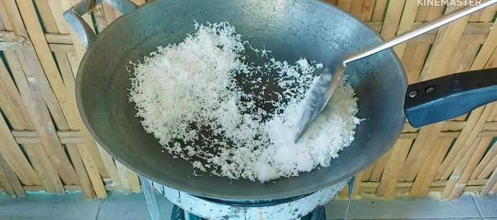 Roast white coconut over low heat until yellow.