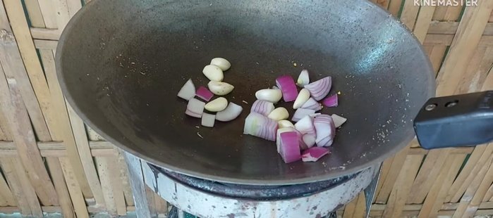 Roast shallots and garlic, then add dried chilies and roast until cooked.