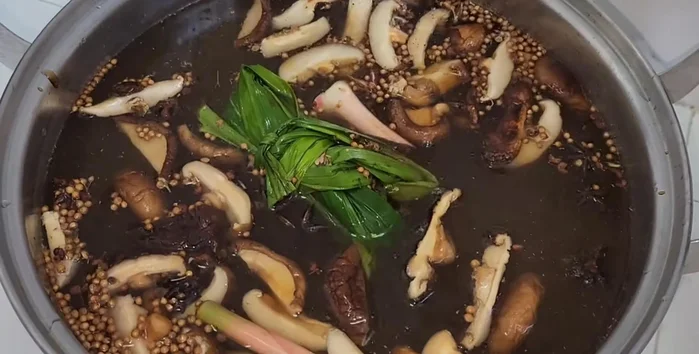 Add ½ to 1 ladle of dark soy sauce for color.