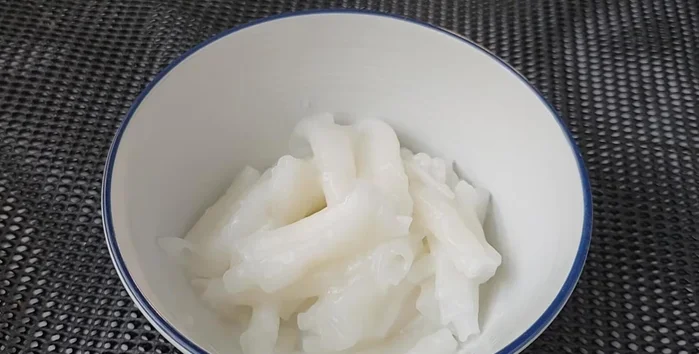 Serve: add noodles, soup, pork innards, crispy pork, bean sprouts, celery, fried garlic, and pepper.