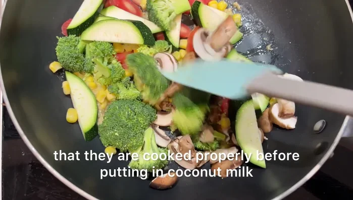 Add all the vegetables (broccoli, carrots, zucchini, mushrooms, and corn) to the pan and cook for 5-7 minutes until properly cooked.