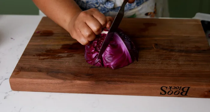 Prep cabbage: Remove the core. Use a mandoline to slice thinly.