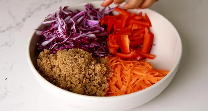 Combine ingredients: Add all prepped veggies and cashews to a large bowl. Squeeze lime juice over.