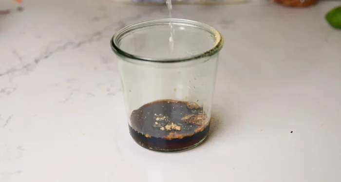 Make dressing: In a separate bowl, whisk together ginger, maple syrup, soy sauce, vinegar, sesame seeds, cashew butter, warm water, and red pepper flakes until smooth.
