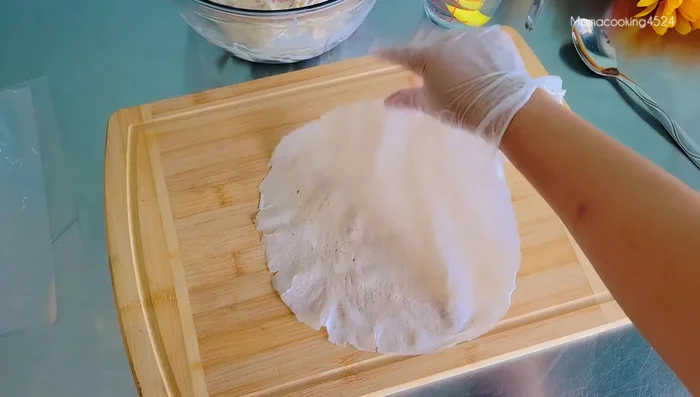 Place 2 spring roll sheets on a flat surface.