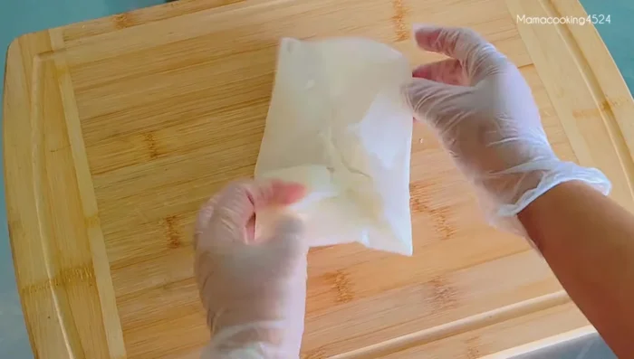 Fold and seal the spring rolls using water to adhere the edges.