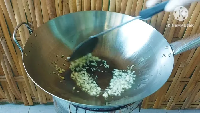 Add chopped garlic and stir-fry until fragrant.