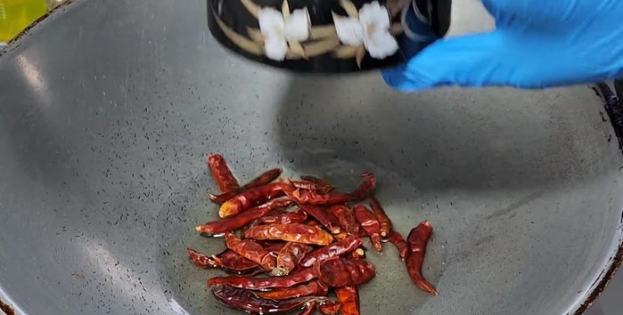 Fry the dried chilies until fragrant.
