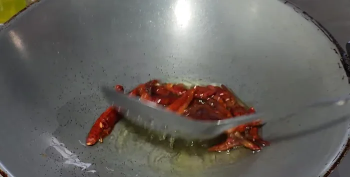 Fry the dried fish until slightly crispy.
