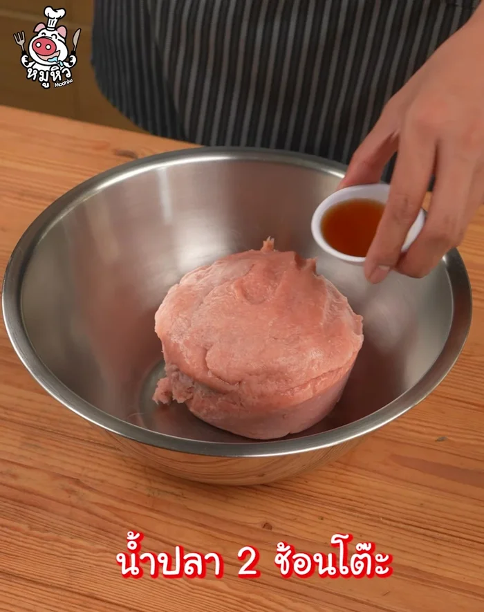 Prepare the Hor Mok mixture: Grate the fish meat into a pan. Season with fish sauce, seasoning powder, shrimp paste, curry paste, and crack in 3 eggs. Mix until well combined. The mixture should be liquidy.