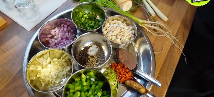 Prepare the ingredients: Chop garlic, chili/pepper, galangal, coriander root, lemongrass, Thai basil, and turmeric into small pieces.
