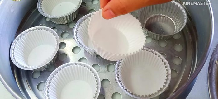Scoop the batter into aluminum cups, filling them about 3/4 full.