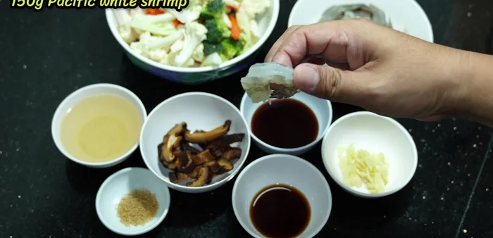 Prepare the shrimp: Clean and devein the shrimp; remove shells. (23.119)