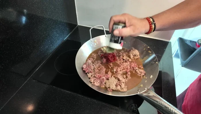 Stir in tomato puree.
