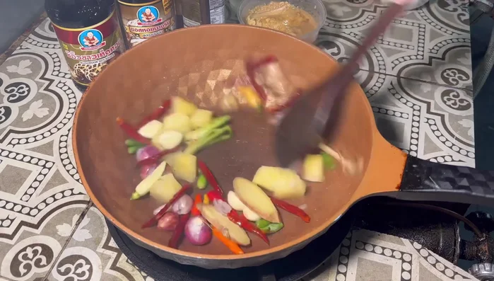 Add pineapple and stir-fry until slightly crispy.