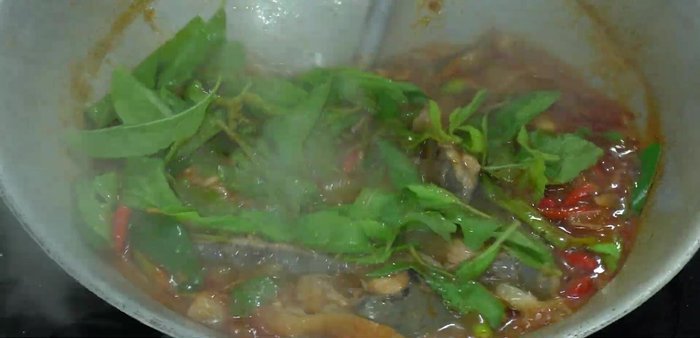 Add basil leaves and cook until wilted.