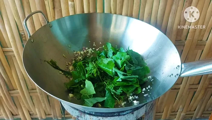 Add the morning glory leaves and stir-fry.