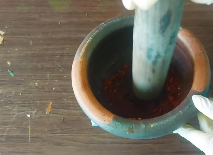 Add shrimp paste and pound until well blended to create the curry paste.