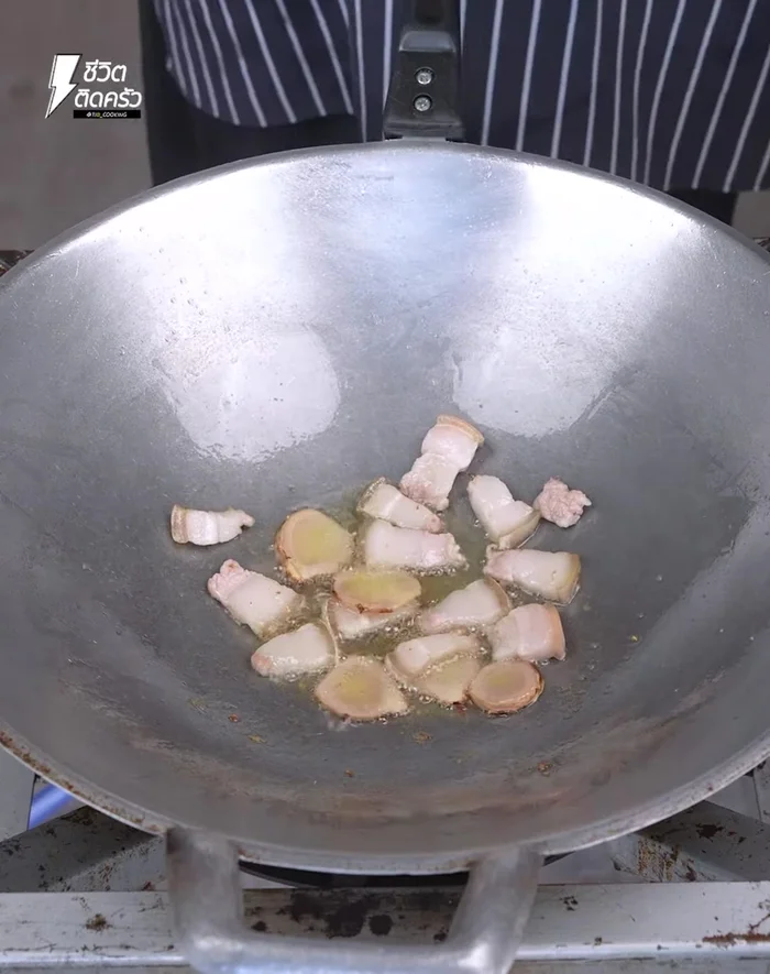 Add the marinated glass noodles and sauce to the pan. Mix well, ensuring the noodles are coated evenly. Cover and cook for about 5 minutes.