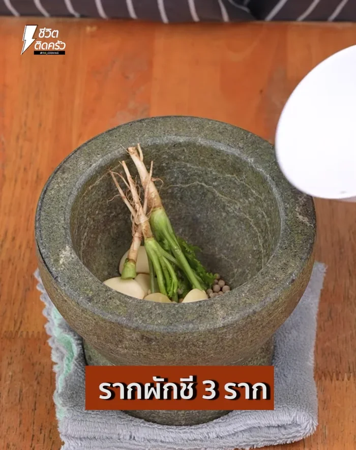 Pound together galangal roots, garlic, and chili in a mortar until finely ground.