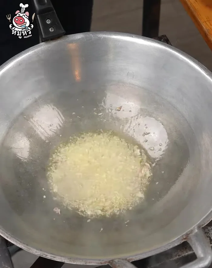 Add the marinated pork and stir-fry until it's dispersed.