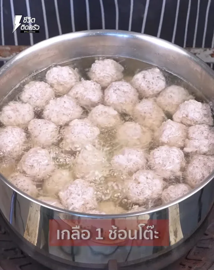 Once pork balls are cooked (they will float and change color), add soup cube, salt, and seasoning sauce.
