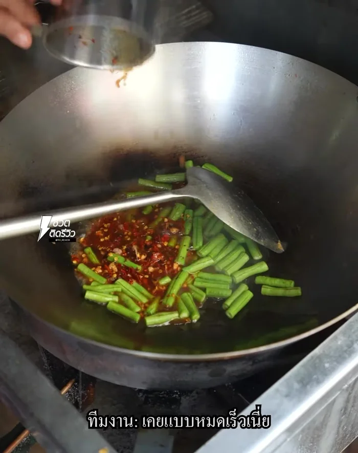 Stir-fry garlic and chili. This adds a spicy kick to the dish.