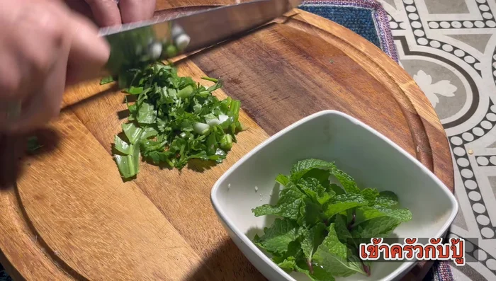 Prepare shallots, coriander, and mint leaves for garnish.