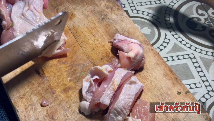 Cut chicken thighs into bite-sized pieces.