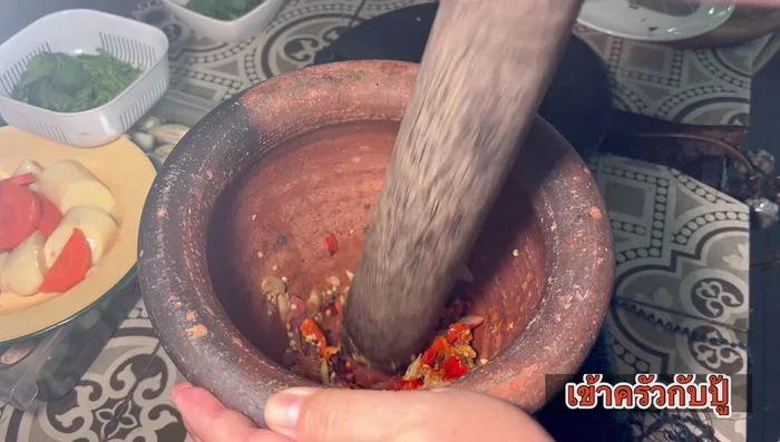 Pound chili paste ingredients in a mortar until finely blended. Add mushrooms and pound together.