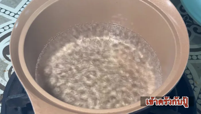 Prepare clear soup: Heat water, add pork balls, carrots, soup cube, egg tofu, white soy sauce, mushroom flavoring, and chives.