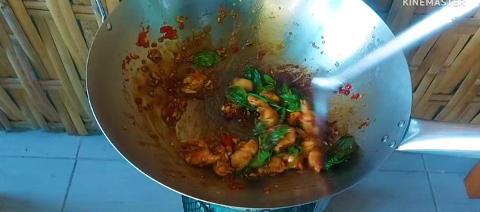 Add basil: Add basil leaves and stir-fry until just cooked.