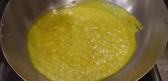 Add vegetables (eggplant, bamboo shoots, etc.) and Cha-Plu leaves. Simmer until chicken is cooked through and vegetables are tender.