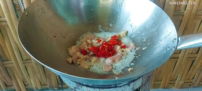 Add the roughly chopped red chili peppers and garlic.