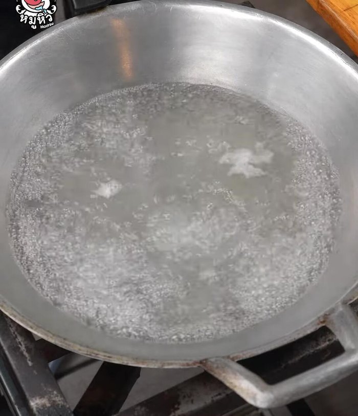 Boil the pig ears: Heat a pot of water, add salt to remove fishy smell (88), and boil the pig ears until cooked (94.119). Let them cool and dry (97.119).