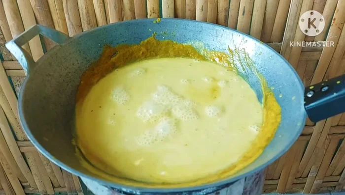 Add the remaining coconut milk and bring to a boil.